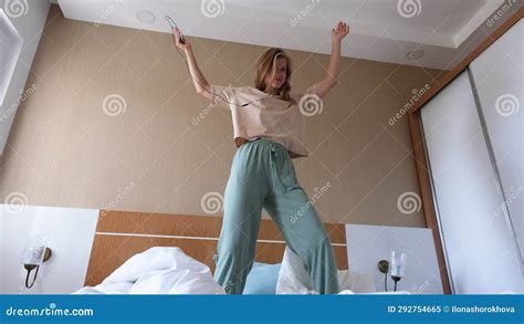 Young Woman Dancing On The Bed In Hotel Room Stock Video Video Of