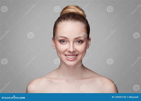 Happy Beautiful Toothy Smiley Blonde Woman With Bun Hairs Looking At Camera Purity Beauty And