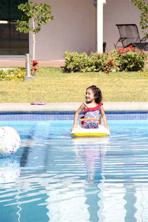 Year Old Latina Girl Swims In The Pool With An Inflatable Float Toy Very Happy Enjoying Her