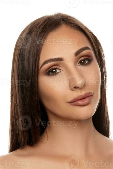 Close Up Portrait Of A Brunette Nude Model Girl With Professional Evening Make Up And Plump Lips