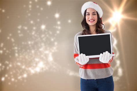 Premium Photo Festive Brunette Showing A Laptop Against Blurred