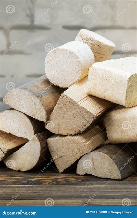 Stack Of Firewood And Wood Heating Briquettes Stock Photo Image Of