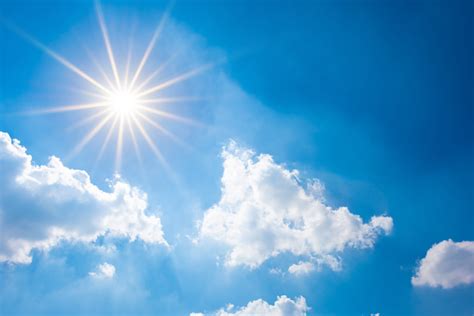 blue sky  bright sun  clouds stock photo  image