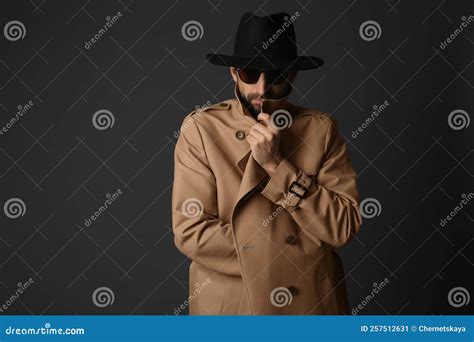 Exhibitionist Exposing Naked Body Under Coat On Black Background Royalty Free Stock Image