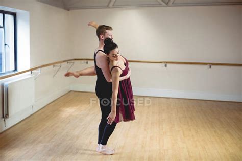 Sportive Ballet Partners Dancing Together In Modern Studio Teamwork