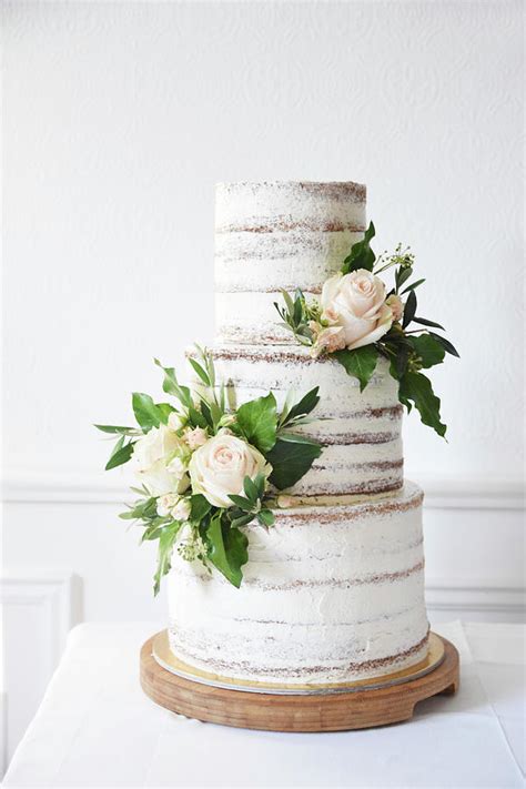 A Naked Three Tier Wedding Cake Decorated With Roses Photograph By So Schmeckt Liebe Fine Art