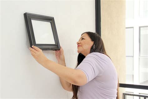 Year Old Latina Woman Decorates Her New Apartment That She Bought