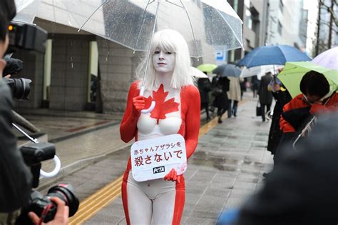 A woman from the "PETA" member in front of the Canadian embassy ...