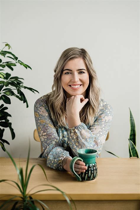 Nutritionist Branding Photos Sitting At A Wood Desk Surrounded By