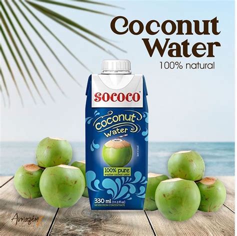 An Advertisement For Coconut Water On A Wooden Table