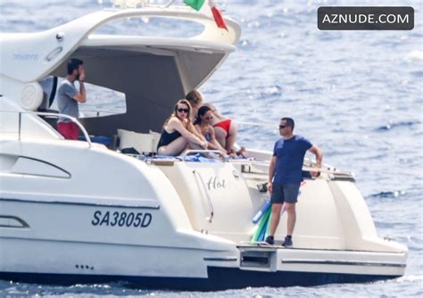 Amber Heard Enjoys A Day In A Red Bikini With Friends Aboard A Yacht On