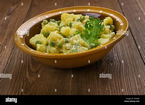 Jamaican Spicy Potato Curry Stock Photo Alamy