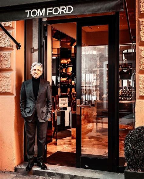 A Man Standing In Front Of A Store