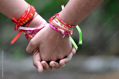 Best Friends Holding Hands Wearing Friendship Bandshappy Friendship