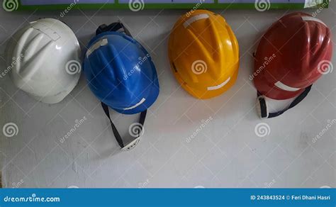 Safety Helmet Hanging On The Wall Differents Colour Of Safety Helmets