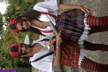 Two Hot Girls Showing Their Nice Figures In Uniforms Photos