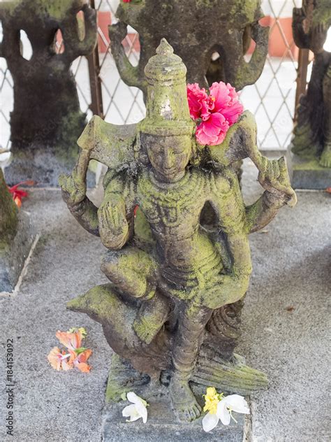 Statue of deity Shani, lord of the Saturn, with a raised hand giving ...