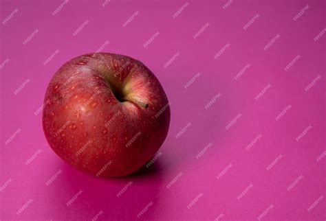 Premium Photo Rotten Apple Fruit Isolated On A Puple Background