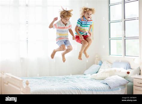Child Jumping Bed Parents Hi Res Stock Photography And Images Alamy