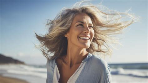 Premium Ai Image Happy Smiling Mature Woman With Loose Hair In The Wind