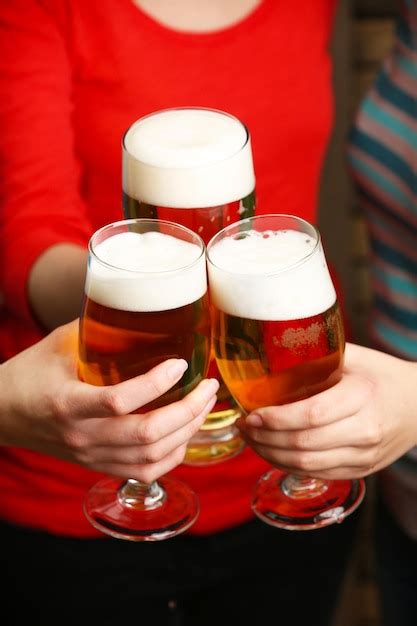 Premium Photo Beer In Female Hands Closeup