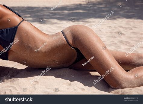 Girl On Sand Bikini Lying On Stock Photo Edit Now