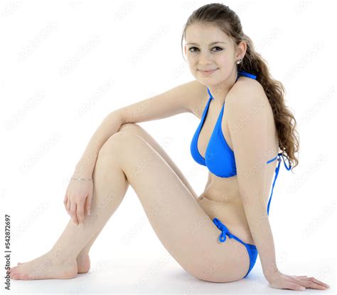 Pretty Teenage Girl Wearing Blue Bikini In Front Of White Background Isolated In Studio Stock