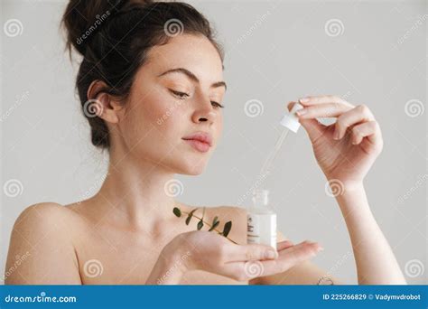 Half Naked Brunette Woman Showing Face Serum And Eucalyptus Stock Image Image Of Beauty Model