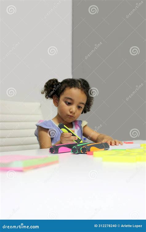 3 Year Old Latina Brunette Girl With Curly Hair Draws As Therapy For Autism And Attention