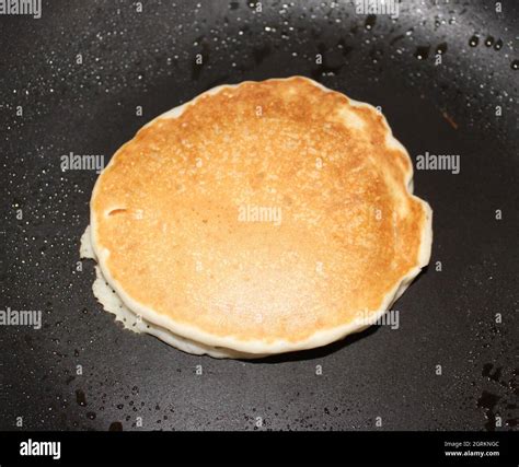 Single Pancake Cooking In A Skillet Stock Photo Alamy