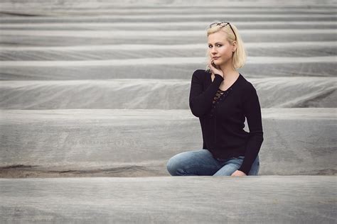 Amazing Blonde Girl Posing In A White Shirt Outdoors Photos