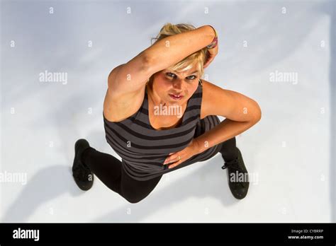 Blonde Cute Girl Dancing Shot Outdoor From Above With Flash On White Background Stock Photo Alamy