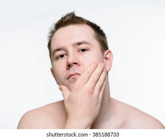 Стоковая фотография Naked Man Stroking His Face After