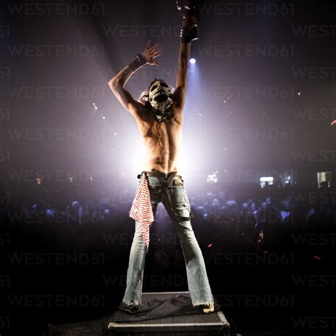 Rear View Of Man Standing On Stage At Concert Stock Photo