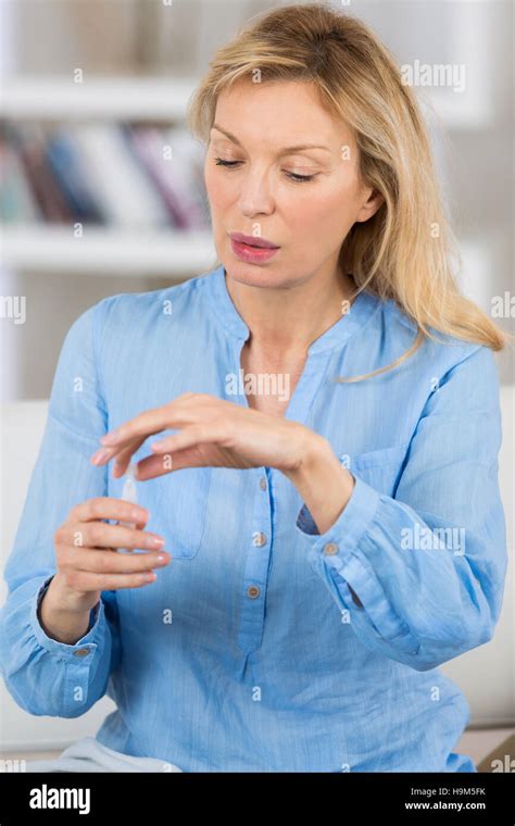 Mature Blond Woman In Pain At Home Stock Photo Alamy