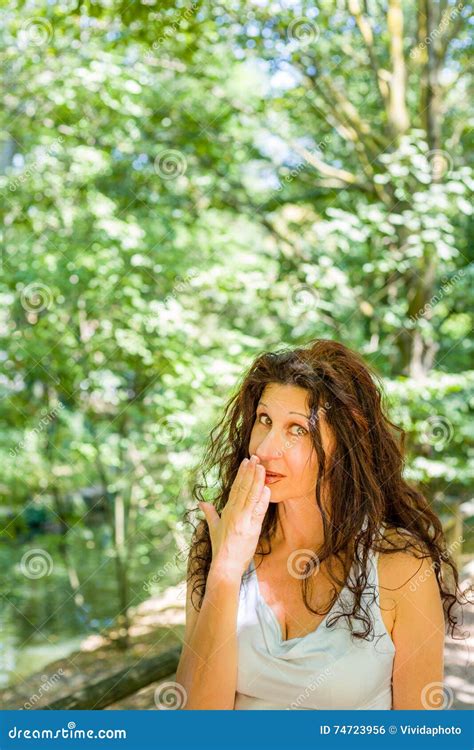 Busty Classy Mature Woman Covering Her Mouth Stock Photo Image Of Space Gesture