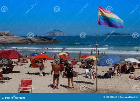 The Famous Copacabana Beach With A Gay Flag Lgbt Rainbow Flag Plus Among Bathing People White