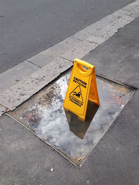 Someone put a "caution wet floor" sign in a puddle. : r/mildlyinteresting