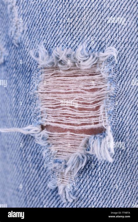 torn jeans closeup stock photo alamy
