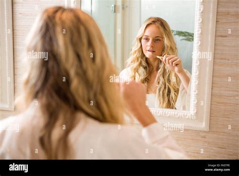 Blonde Woman Brushing Her Teeth Stock Photo Alamy