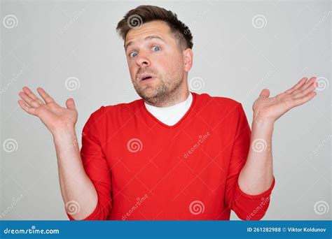 Man Clueless and Confused Expression with Arms and Hands Raised. Stock