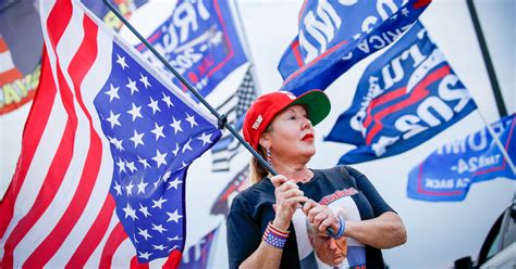 Trump Hawks American Flag Pins With His Name In Gold Splashed Across