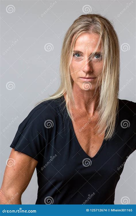 Attractive Tanned Woman With Long Blond Hair Stock Photo Image Of Intently Mature