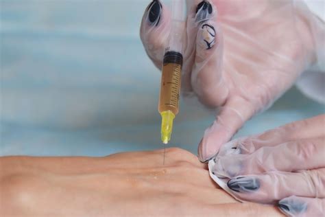 Premium Photo Doctor Doing Stem Cell Therapy On A Patients Elbow