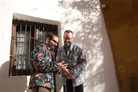 Real Marriage Of Gay Couple With Travel Suitcases Checking Hotel Location On Their Cell Phone