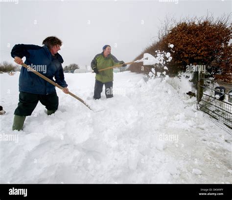 Farmers dig out their snow covered driveway near the village of Bratton ...