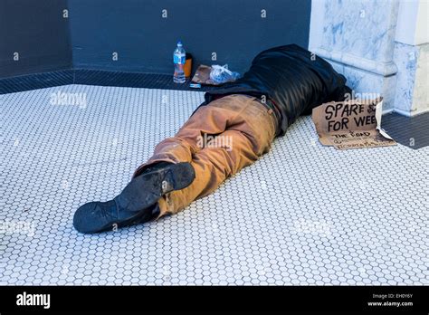 Homeless Man Sleeping On Ground Vancouver British Columbia Canada