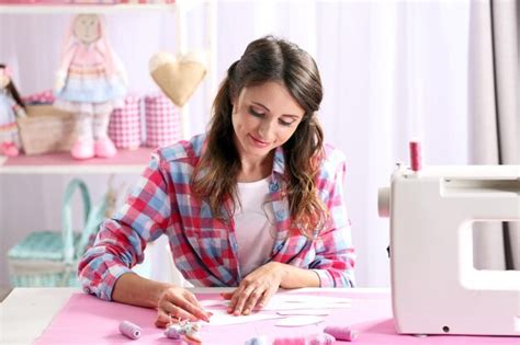 Premium Photo | Beautiful young needlewoman in workshop