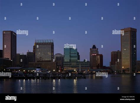 Baltimore city skyline with the harbor at dusk Stock Photo - Alamy