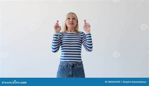 Blonde Woman Crossing Fingers In Hope On White Background Stock Footage Video Of Expecting